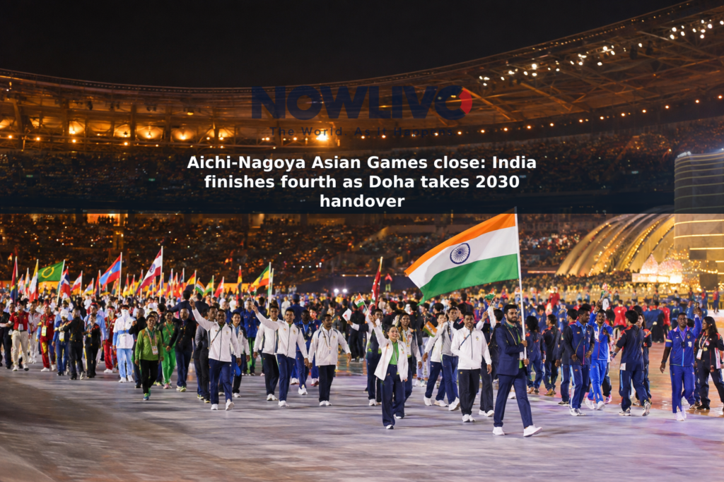 Athletes and national flags fill a lit stadium during an Asian Games closing ceremony in Nagoya.