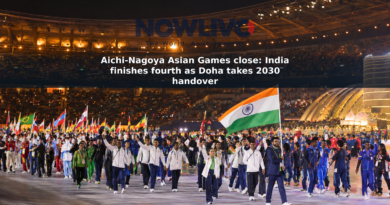 Athletes and national flags fill a lit stadium during an Asian Games closing ceremony in Nagoya.