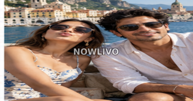 Young celebrity-style couple posing on a sunny European-style waterfront and taking a playful selfie.