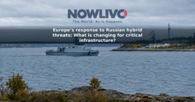 Naval patrol ship offshore near a coastal communications facility on an overcast Baltic Sea day.