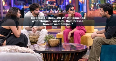 Adult contestants in a brightly lit reality-show living room during a tense group discussion.