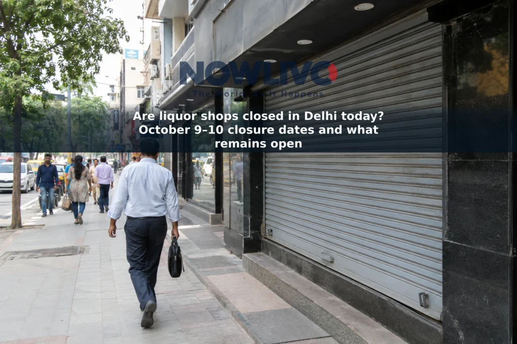 Closed shop shutter on a Delhi commercial street, with adult pedestrians in the background.