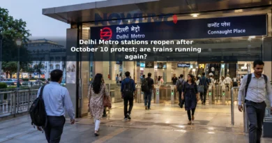Adult commuters entering and leaving an open Delhi Metro station entrance in the evening.