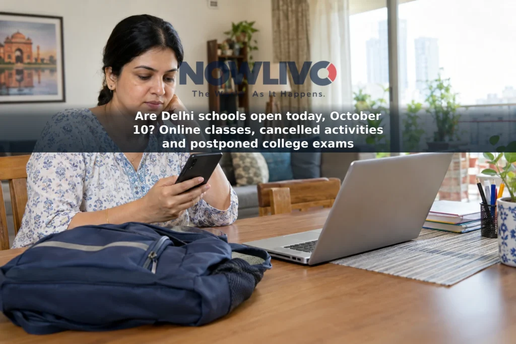 A parent checks a phone beside a school bag and a laptop set up for online classes.