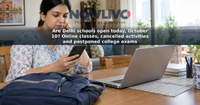 A parent checks a phone beside a school bag and a laptop set up for online classes.