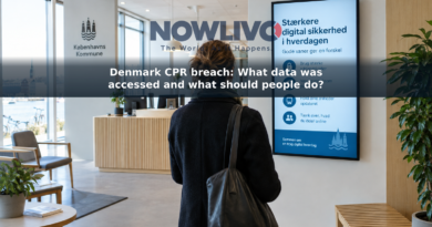 Visitor viewing a digital-safety display in a Danish public-service office.