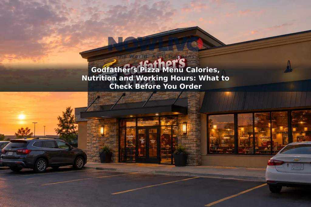 Godfather’s Pizza storefront at golden hour with warm light glowing through the windows.