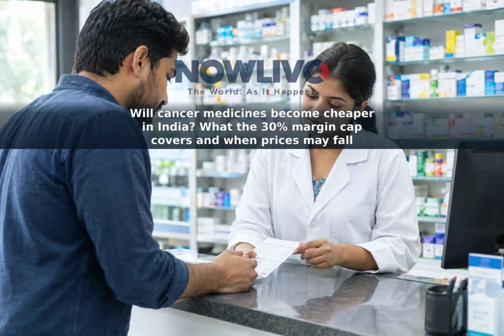 An adult customer speaks with a pharmacist about a medicine bill at a pharmacy counter in India.