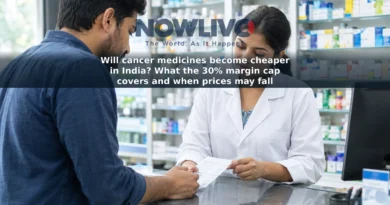 An adult customer speaks with a pharmacist about a medicine bill at a pharmacy counter in India.