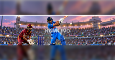 Indian batter in blue playing an attacking cricket shot against a West Indies fielder in a packed stadium