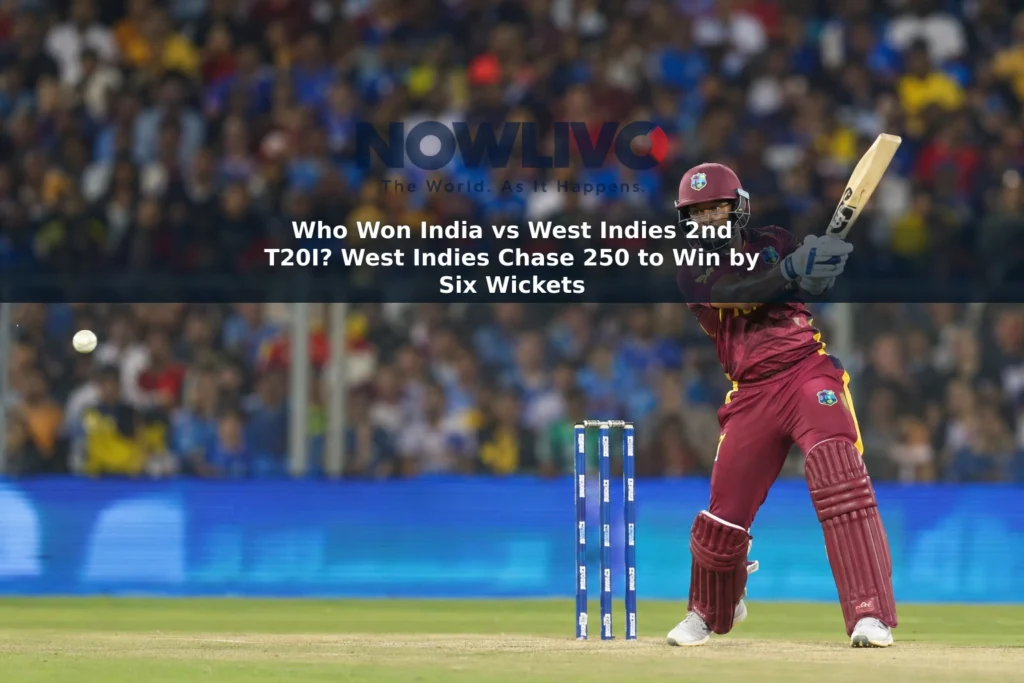 West Indies batter Shai Hope plays a shot in a floodlit cricket stadium.