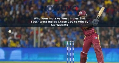 West Indies batter Shai Hope plays a shot in a floodlit cricket stadium.