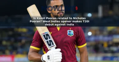 Editorial-style image of Kamil Pooran holding a cricket bat at a stadium.