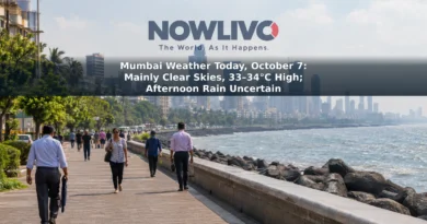 Mumbai’s Marine Drive under bright, slightly hazy skies, with pedestrians walking along the waterfront