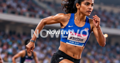 Indian woman sprinter accelerating on a floodlit athletics track