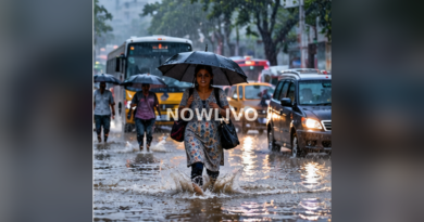 Rain-swept South Indian city street with pedestrians and umbrellas; illustrative image with centered NOWLIVO watermark.