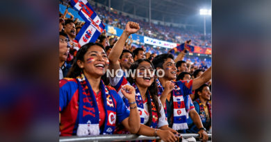 Supporters cheering in stadium with blue red flags at night; generated editorial illustration, centered NOWLIVO watermark.