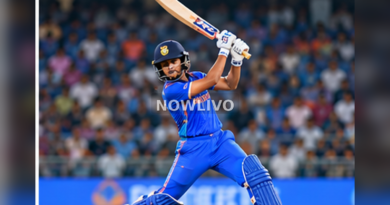 Indian cricketer batting under stadium lights with spectators in the background