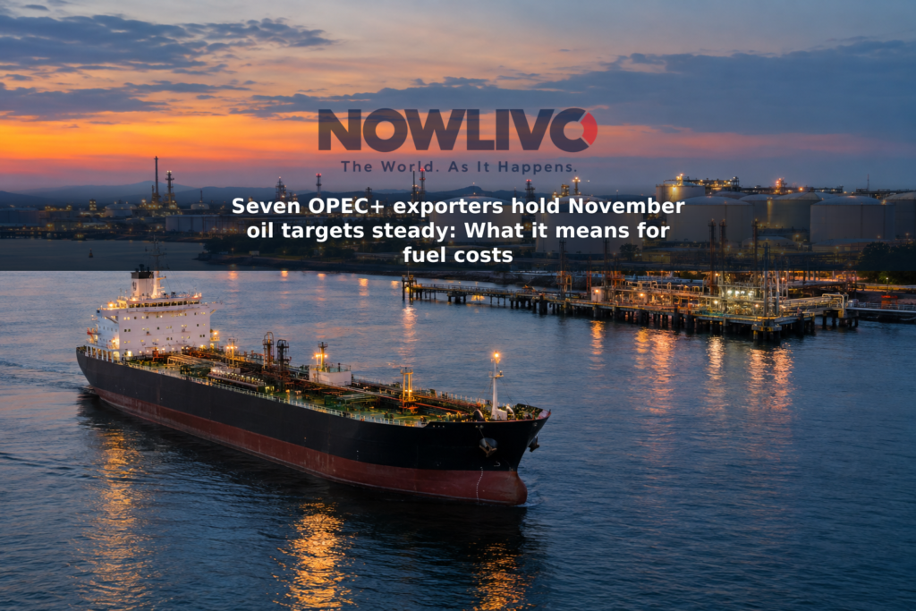 Oil tanker alongside a petroleum terminal with storage tanks and loading equipment at dusk.