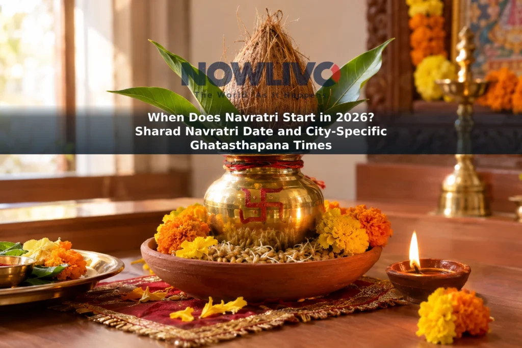 A Navratri kalash with leaves and a coconut, surrounded by marigolds, sown grains and a lit diya.