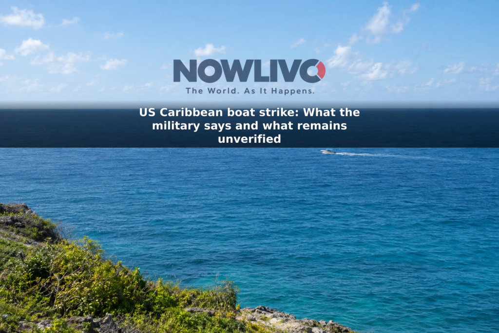 Illustrative view of a small boat in the distance on open Caribbean water.