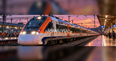 Long modern orange-and-silver Indian train standing at a busy station at sunset