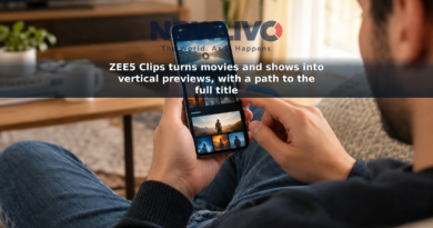 An adult viewer holds a phone showing vertical entertainment previews while browsing at home.